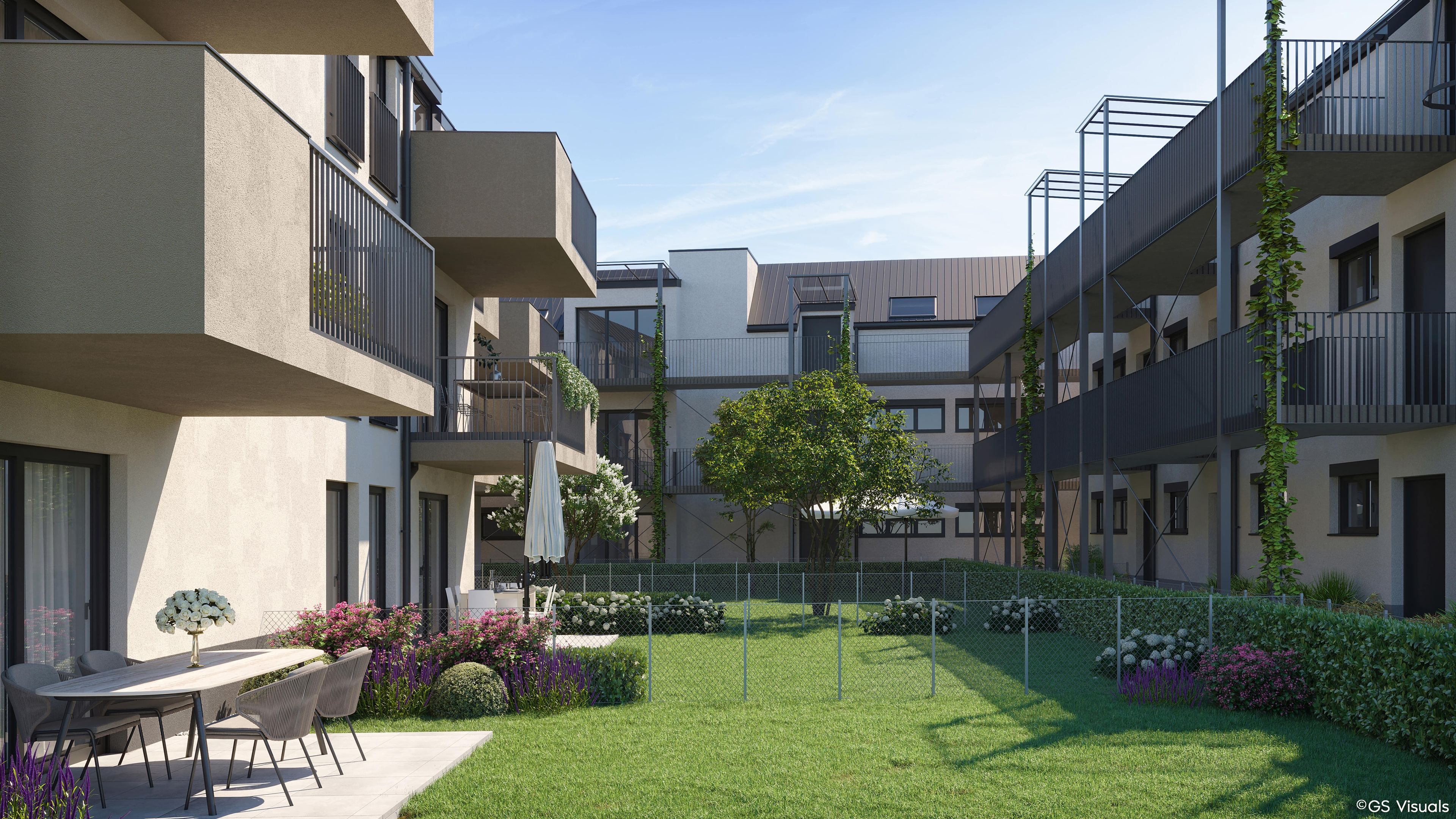Modernes Mehrfamilienhaus mit Innenhof und Terrassen