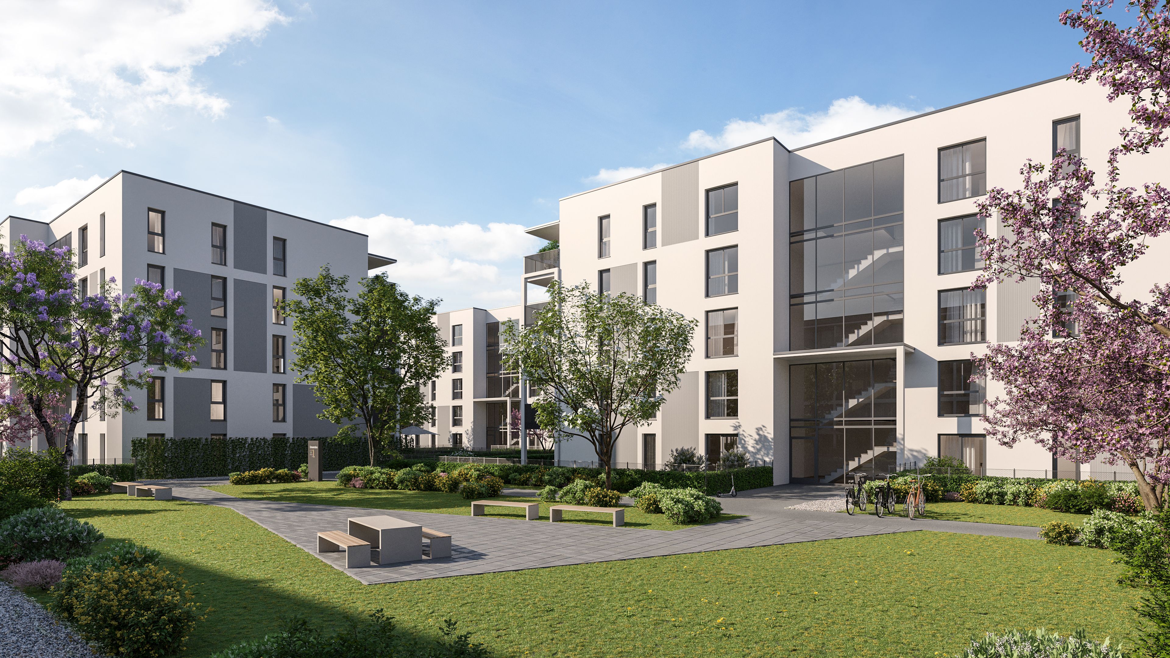 Moderne Mehrfamilienhäuser mit grünem Innenhof